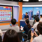 Exciting jnetoto live draw event capturing participants eagerly watching real-time lottery results.