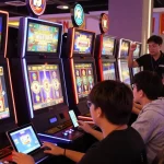 Players enjoying a vibrant TEMPOTOTO slot gaming experience in a modern lounge.