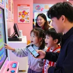 Customer engaging with a colorful slot display in a retail store.